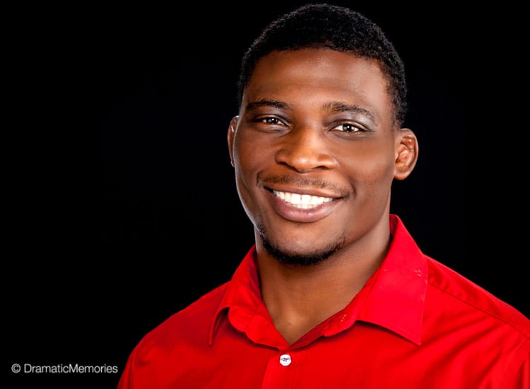 african american young man in a red shirt