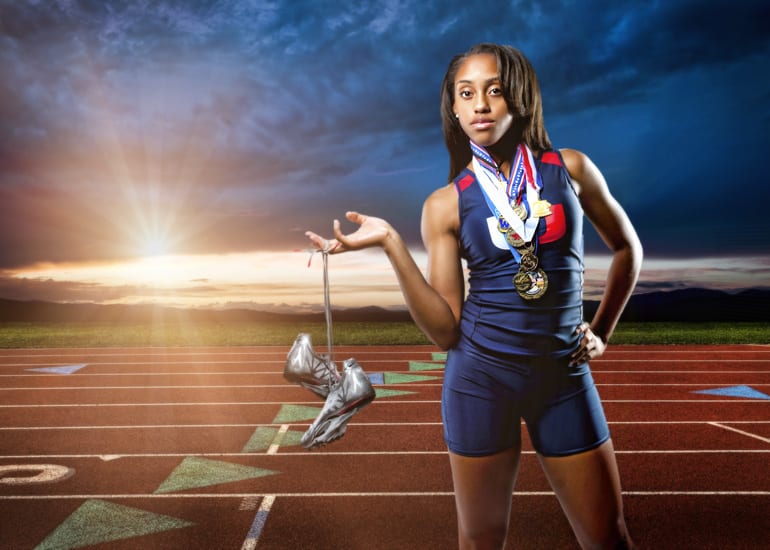 high school track champion with her medals around her neck