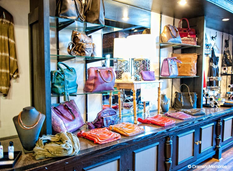 colorful purses displayed at a woman's clothing store